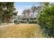 Ranch style home with mature landscaping and a spacious yard at 3027 Saint Annes Nw Ln, Atlanta, GA 30327
