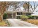 House exterior with a carport and landscaping at 3027 Saint Annes Nw Ln, Atlanta, GA 30327