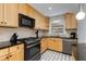 Modern kitchen boasts granite countertops and stainless steel appliances at 3027 Saint Annes Nw Ln, Atlanta, GA 30327