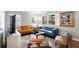 Living area with hardwood floors, comfortable seating, and large windows at 3027 Saint Annes Nw Ln, Atlanta, GA 30327
