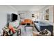 Living room featuring two sofas, a coffee table, and ample natural light at 3027 Saint Annes Nw Ln, Atlanta, GA 30327