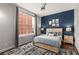 Spacious bedroom with a large window and wood-like flooring at 1029 Piedmont Ne Ave # 102, Atlanta, GA 30309