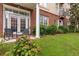 Private patio with rocking chairs and lush landscaping at 1029 Piedmont Ne Ave # 102, Atlanta, GA 30309