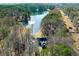 Aerial view of house and property, showcasing a private lake at 1126 Wedgefield Dr, Marietta, GA 30064