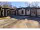 Home exterior showcasing a covered carport and paved parking area at 1126 Wedgefield Dr, Marietta, GA 30064