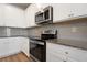 Kitchen details: granite countertops and stainless steel range and microwave at 2844 Saratoga Lake Vw, Decatur, GA 30034