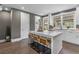 Modern kitchen with white cabinets and a large island at 1160 Ormewood Ave # 10, Atlanta, GA 30316