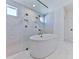 Spa-like bathroom featuring a freestanding tub and walk-in shower at 2144 Suncrest Pt, Marietta, GA 30064