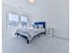 Bright bedroom with a double bed, window, and grey carpet at 2144 Suncrest Pt, Marietta, GA 30064