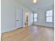 Bright bedroom with hardwood floors and two large windows at 2144 Suncrest Pt, Marietta, GA 30064