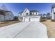 Two story white brick home with three car garage and driveway at 2144 Suncrest Pt, Marietta, GA 30064