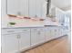 White kitchen cabinets with gold hardware and quartz countertops at 2144 Suncrest Pt, Marietta, GA 30064