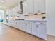 White kitchen cabinets with gold hardware and quartz countertops at 2144 Suncrest Pt, Marietta, GA 30064