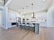 Modern kitchen with white cabinets, quartz countertops, and stainless steel appliances at 2144 Suncrest Pt, Marietta, GA 30064