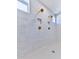 Large walk-in shower with marble tile and rainfall shower head at 2144 Suncrest Pt, Marietta, GA 30064