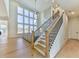 Modern staircase with a light oak finish and black metal balusters at 2144 Suncrest Pt, Marietta, GA 30064