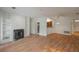 Spacious living area featuring hardwood floors and a fireplace at 484 Sherman Way, Decatur, GA 30033