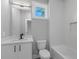 Bathroom with single vanity, shower/tub combo, and window at 1160 Ormewood Ave # 11, Atlanta, GA 30316