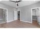 Spacious bedroom with hardwood floors, ceiling fan, and walk-in closet at 1160 Ormewood Ave # 11, Atlanta, GA 30316