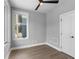 Bedroom with hardwood floors, large window, and ceiling fan at 1160 Ormewood Ave # 11, Atlanta, GA 30316