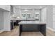 Modern kitchen with island, stainless steel appliances, and white shaker cabinets at 1160 Ormewood Ave # 11, Atlanta, GA 30316