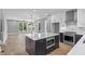 Modern kitchen with white cabinets and marble backsplash at 1160 Ormewood Ave # 11, Atlanta, GA 30316
