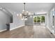 Spacious living room with large windows and chandelier at 1160 Ormewood Ave # 11, Atlanta, GA 30316