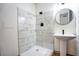 Basement bathroom with marble-look shower and pedestal sink at 2992 1St Sw Ave, Atlanta, GA 30315