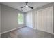 Bedroom with window, ceiling fan and double closets at 700 Wilson Mill Sw Rd, Atlanta, GA 30331