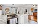 Modern kitchen with white cabinets, stainless steel appliances, and a farmhouse sink at 3741 Hickory Se Cir, Smyrna, GA 30080