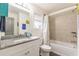 Bathroom with a shower/tub combo and granite countertop at 723 Campbell Cir, Hapeville, GA 30354