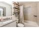 Bathroom with a tub, granite countertop and floating shelves at 723 Campbell Cir, Hapeville, GA 30354