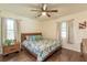Bedroom with a ceiling fan and floral comforter at 723 Campbell Cir, Hapeville, GA 30354