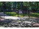 Small dog park with a fenced area, waste disposal, and a shaded walkway at 723 Campbell Cir, Hapeville, GA 30354