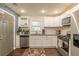 Well-equipped kitchen featuring stainless steel appliances and granite countertops at 723 Campbell Cir, Hapeville, GA 30354