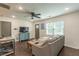 Bright living room with hardwood floors, comfy sofa, and large window at 723 Campbell Cir, Hapeville, GA 30354
