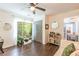 Spacious office with hardwood floors, a room divider, and plenty of natural light at 723 Campbell Cir, Hapeville, GA 30354