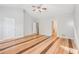 Main bedroom with hardwood floors and access to en-suite bathroom at 7091 Fringe Flower Dr, Austell, GA 30168