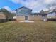 Large backyard with a patio and a partially fenced area at 2314 Emerald Springs Dr, Decatur, GA 30035