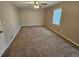 Large bedroom with neutral walls and carpet at 2314 Emerald Springs Dr, Decatur, GA 30035