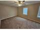 Spacious bedroom with carpeted floor and ceiling fan at 2314 Emerald Springs Dr, Decatur, GA 30035