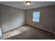 Well-lit bedroom with large window and neutral walls at 2314 Emerald Springs Dr, Decatur, GA 30035