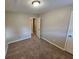 Bright bedroom with carpeted floor and access to hallway at 2314 Emerald Springs Dr, Decatur, GA 30035
