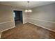 Dining room with neutral walls and carpeting, open to living room at 2314 Emerald Springs Dr, Decatur, GA 30035