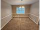 Simple dining area with neutral carpeting and a chandelier at 2314 Emerald Springs Dr, Decatur, GA 30035