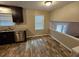Kitchen with dark cabinets, granite counters, and tile floor at 2314 Emerald Springs Dr, Decatur, GA 30035