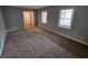 Large living room with neutral walls and carpeting at 2314 Emerald Springs Dr, Decatur, GA 30035