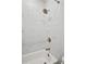 Bathroom with shower/tub combo and marble tile at 290 Walker Ave, Roswell, GA 30076