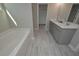 Bathroom with double vanity and a large soaking tub at 804 Trestle Creek Ct, Temple, GA 30179