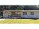 Charming ranch home with white brick exterior, wood accents, and a well-manicured lawn at 987 Forrest Se Cir, Atlanta, GA 30354